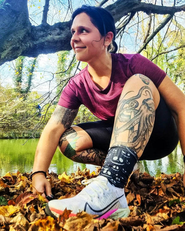 Woman wearing Scary Halloween Socks smiley faces